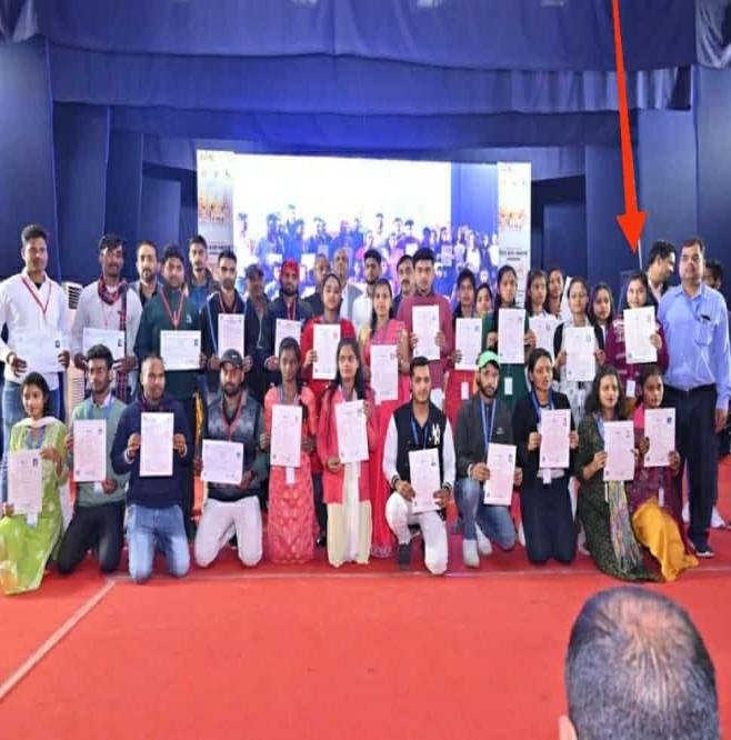 Students with certificates on stage